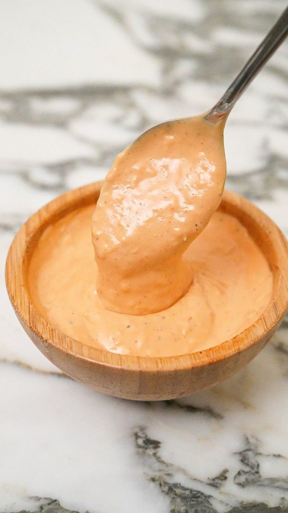 A-bowl-of-creamy-spicy-and-sweet-chilli-mayo-sauce-perfect-for-dipping-or-spreading-served-with-fresh-ingredients