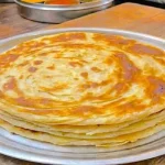 Kenyan chapati torn open to show soft layers